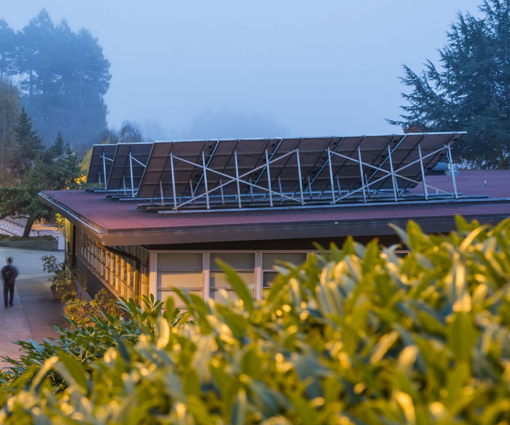 Music building with solar panels on a foggy day